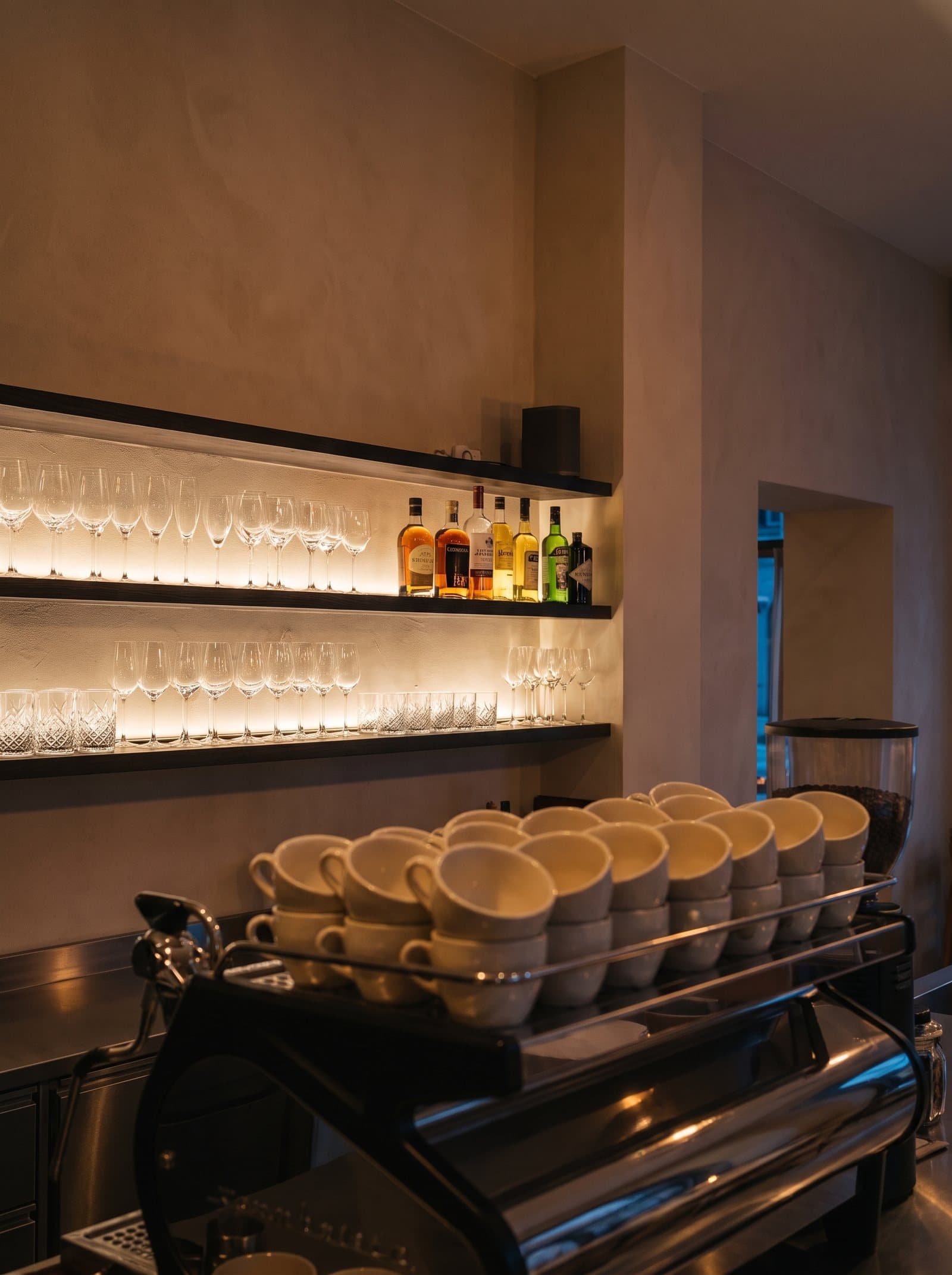 Back bar with glassware and stacked cups