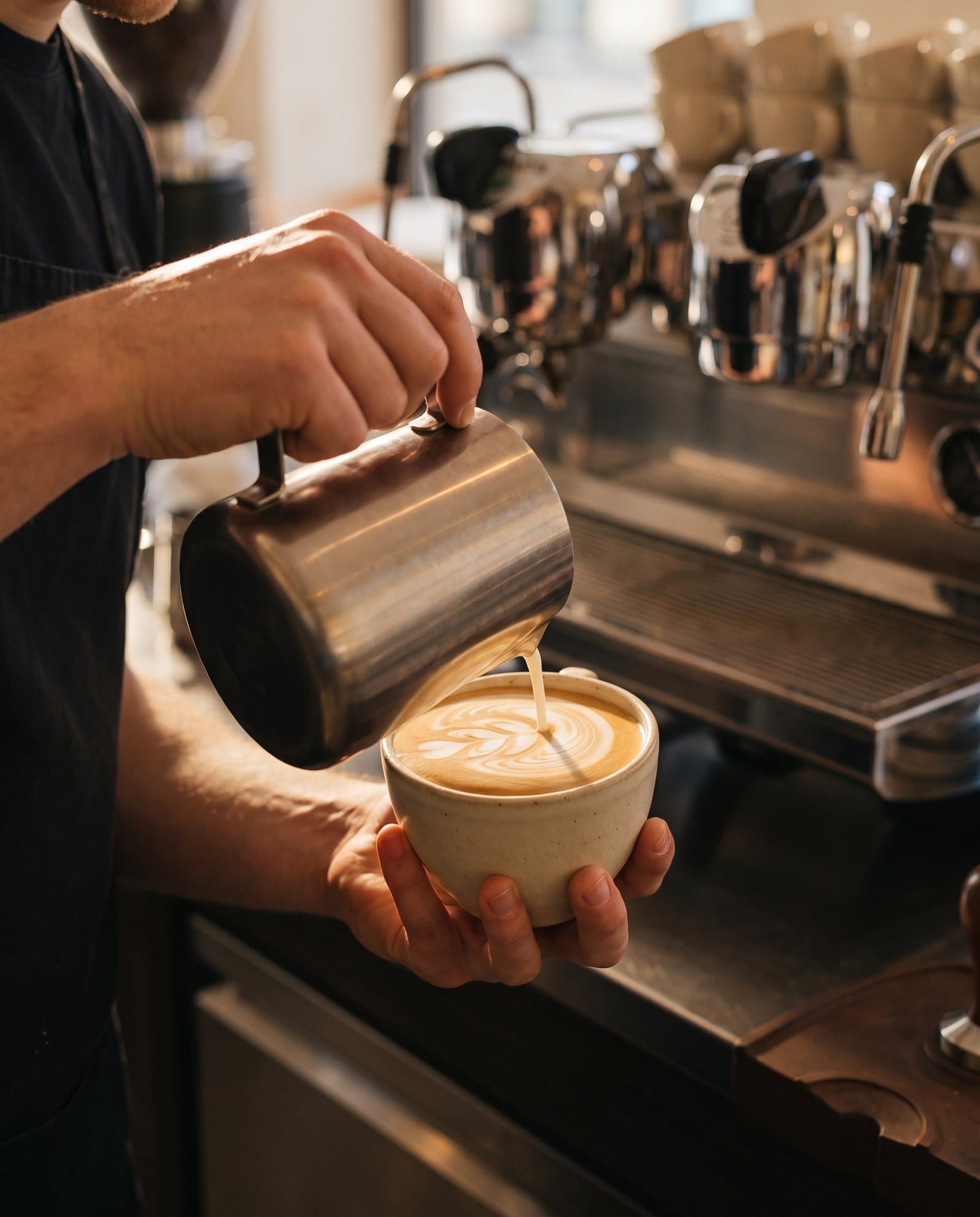 Steamed milk poured into a cup