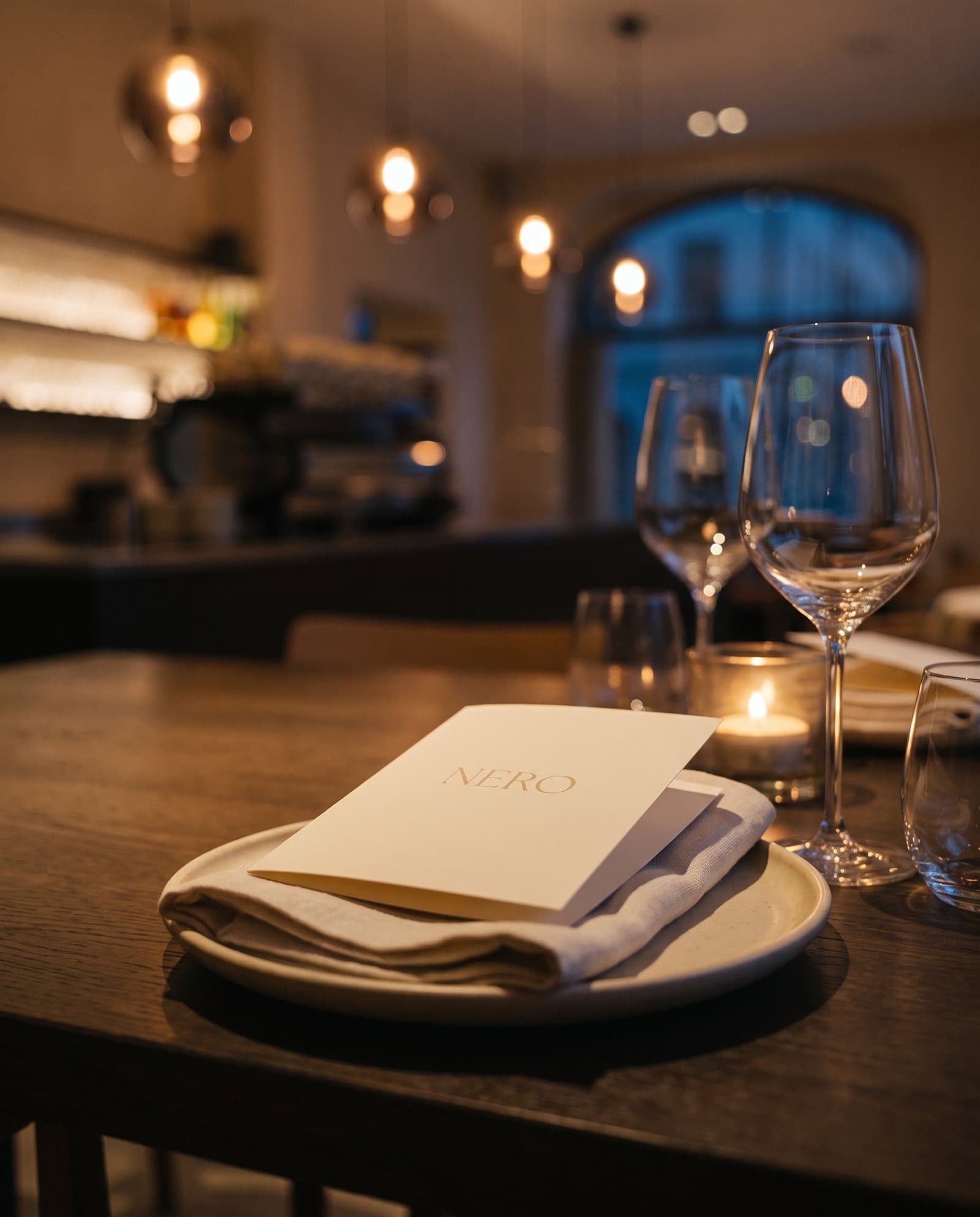 A place setting with a small NERO card