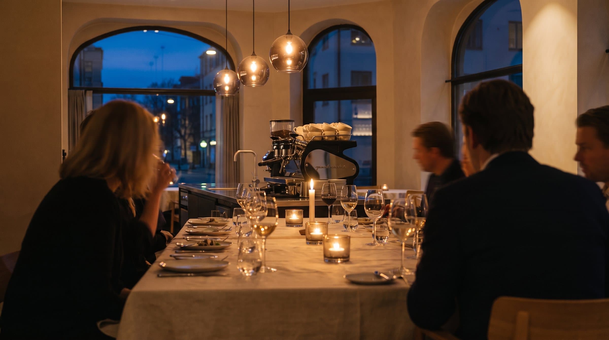 Guests at a long table during evening service